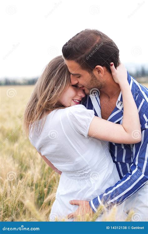 Portrait Of A Young Couple Hugging And Kissing Royalty Free Stock ...