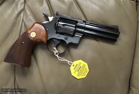 COLT PYTHON 357 MAGNUM, 4” BLUE, MFG. 1969, AS NEW COND.,COMES WITH TEST TARGET, OWNERS MANUAL ...