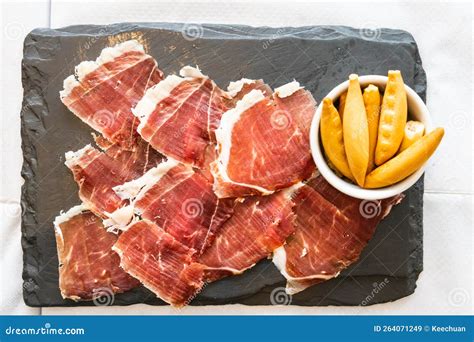 Overhead View of Delicious Iberico or Iberian Ham Served on a Platter with Crackers Bread Stock ...