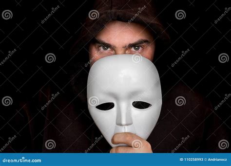 Mysterious Man in Black Hiding His Face Behind White Mask Stock Image - Image of darkness ...