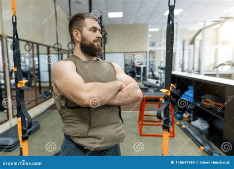 Portrait Muscular Caucasian Bearded Adult Man in Gym, Dressed in Bulletproof Armored Vest ...