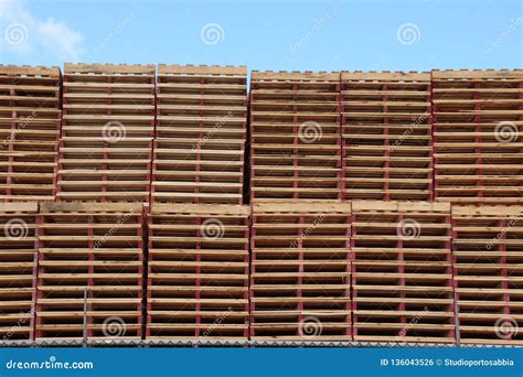 Stacked wooden pallets stock photo. Image of logistic - 136043526