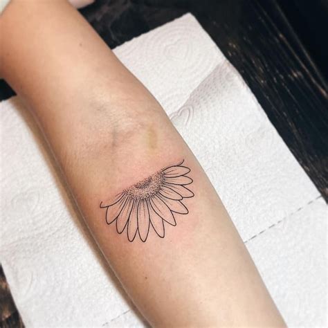 Half sunflower tattoo inked on the forearm | Sunflower tattoo sleeve, Sunflower tattoo simple ...