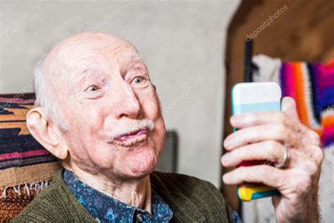 Older man taking silly face selfie — Stock Photo © creatista #80665208