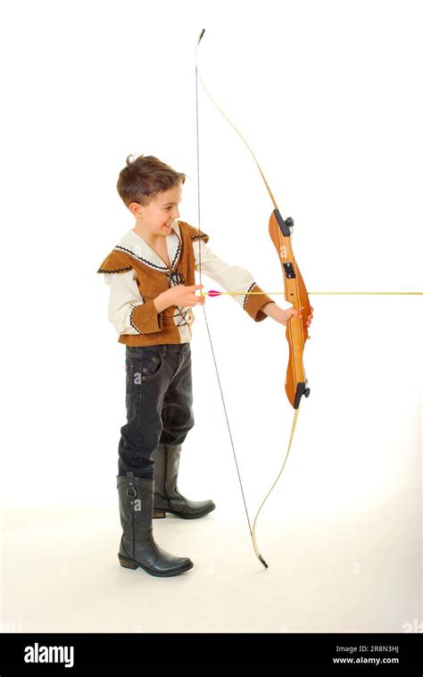 Boy in Robin Hood costume with sports bow, archery, archery shooting ...