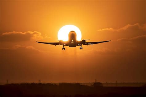 Premium AI Image | A plane is taking off into the sunset