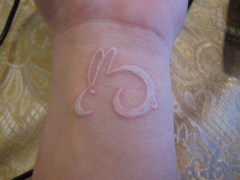 Unique and Creative White Rabbit Tattoo Designs