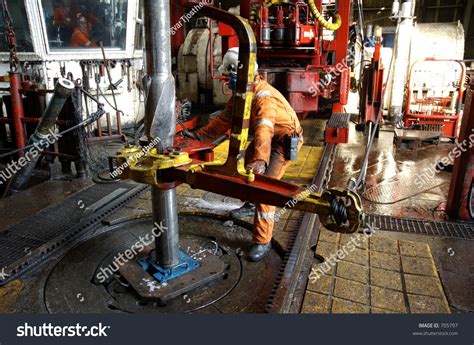 A Roughneck Breaking A Connection With Tongs, Offshore Oil Rig Stock Photo 705797 : Shutterstock