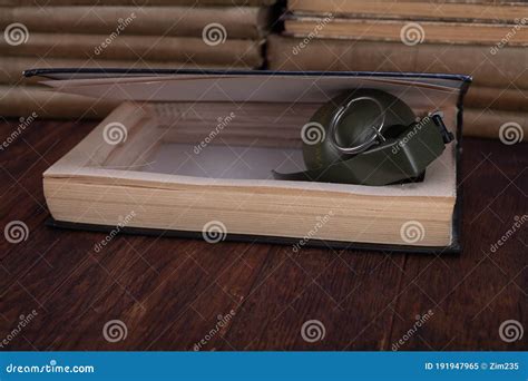 Hand Grenade Hidden in a Book Stock Image - Image of crime, ammunition: 191947965