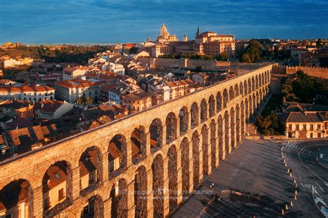 an aerial view of the city and its aqueduct