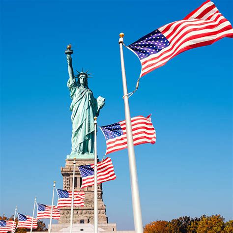 The Statue Of Liberty And The American Flag Stock Photos, Pictures & Royalty-Free Images - iStock