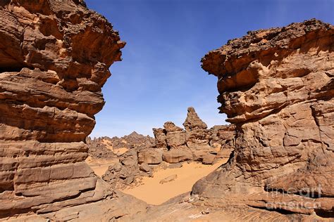 Rock Formations In The Akakus Mountains In The Sahara Desert Photograph by Robert Preston