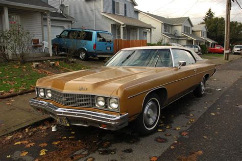 OLD PARKED CARS.: 1973 Chevrolet Impala Custom.