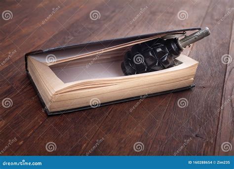 Hand Grenade Hidden in a Book Stock Photo - Image of bullet, kill: 160288654