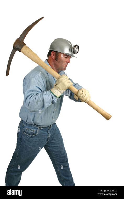 A coal miner using a pick ax in the mines Stock Photo - Alamy