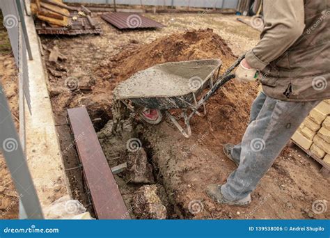 Concrete in a Wheelbarrow at a Construction Site Stock Photo - Image of ...