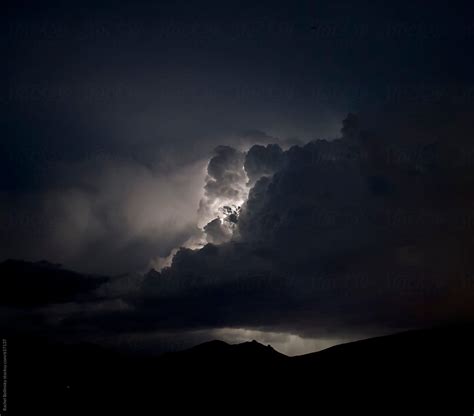 "Lightning Illuminates Clouds In A Stormy Night Sky" by Stocksy Contributor "Rachel Bellinsky ...