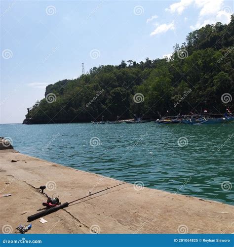 Fishing at the dock stock image. Image of horizon, mast - 201064825