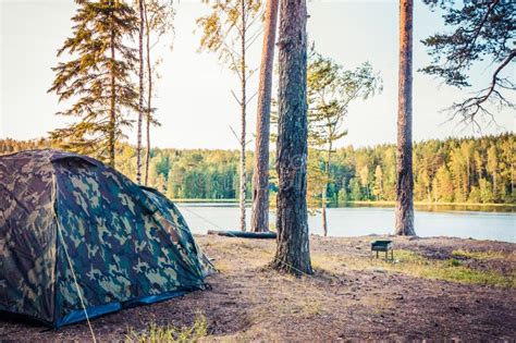 Forest Scenery With Camping Tent On Bank Of Lake Stock Photo - Image of ...