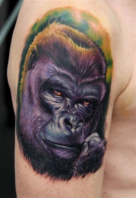 Nice realistic colorful gorilla muzzle tattoo on upper arm - Tattooimages.biz