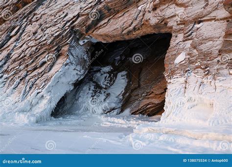 Cave Entrance in Snow-covered Rock Stock Photo - Image of grotto, cold: 138075534