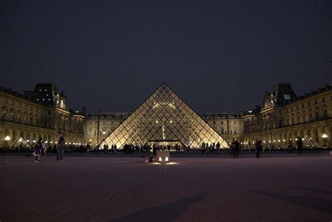 Louvre Museum at night Photograph by Arylana Art