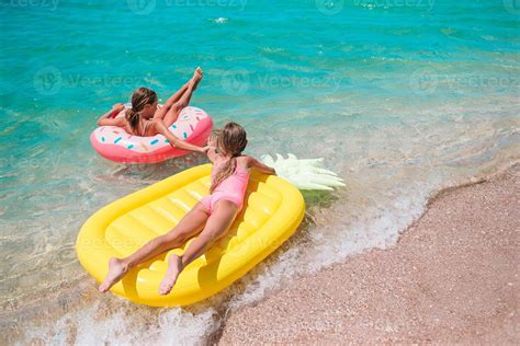 Little girls having fun at tropical beach during summer vacation playing together 18109125 Stock ...