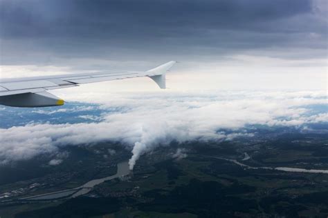 Download Airplane Above Clouds Royalty Free Stock Photo and Image