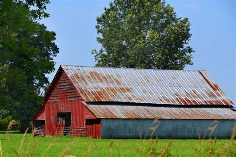 Red Wooden Barn with Tin Roof Stock Image - Image of barn, country ...