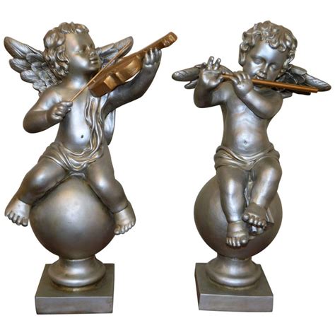 Pair of Silver Ornamental Musician Cherub Sculptures at 1stDibs