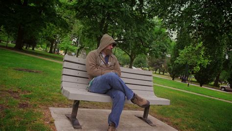 A Sad Man Sits Alone On A Park Bench. Stock Footage Video 3959047 ...