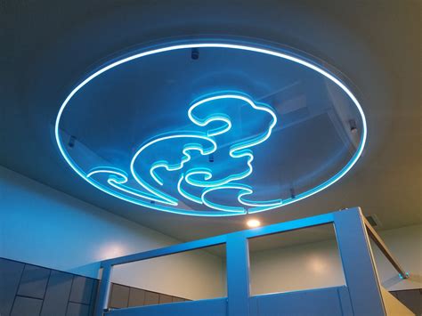 Ceiling-mounted LED (neon look) Blue "Wave" Sign @ Kinjo North Hill by ...