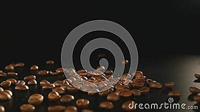 Coffee Beans - Falling. A 96 FpS Macro Shot Of Coffee Beans Falling On Black Surface. A ...