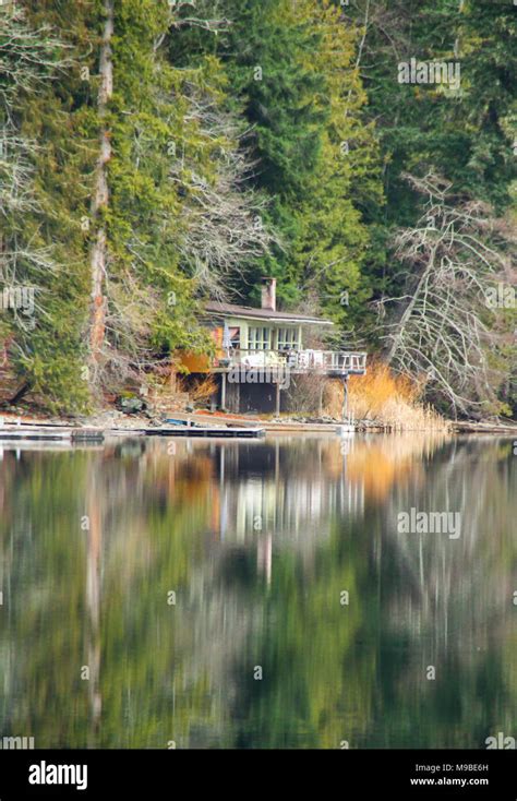 Calm and peaceful lake with reflection Stock Photo - Alamy