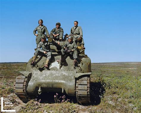 Tank crew with Sherman tank during training maneuvers. Camp Cooke, California. 28 March 1944 ...