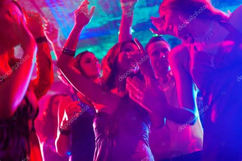 Party people dancing in disco or club — Stock Photo © Kzenon #79224070