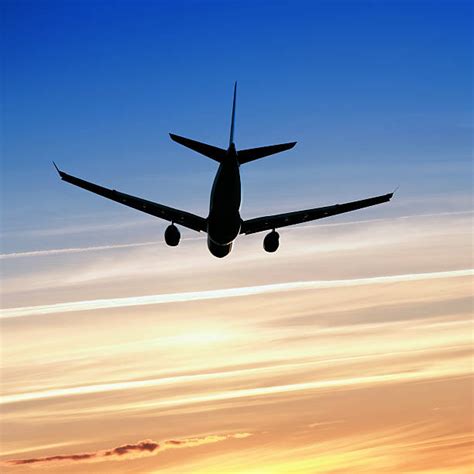 80+ Plane Silhouette Flying In Sky Behind A Vibrant Sunset Stock Photos, Pictures & Royalty-Free ...