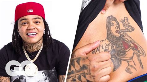 Young M.A Breaks Down Her Tattoos | GQ - YouTube