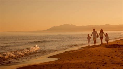 Family Walking Towards Camera On Beach In Stock Footage SBV-300614525 - Storyblocks