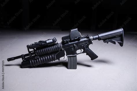 Assault rifle with grenade launcher/Assault automatic rifle with grenade launcher and tactical ...