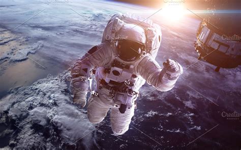 Astronaut in outer space against the backdrop of the planet earth. Elements of this image ...