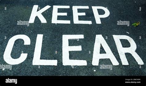 keep clear sign impressed on the road Stock Photo - Alamy