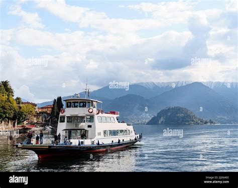 Ferry with passengers floats on Lake Como in Italy Stock Photo - Alamy