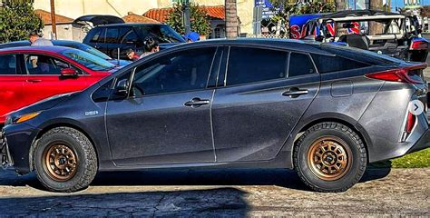 Prius PRIME lifted with the 2" inch lift kit looks ready for battle ...