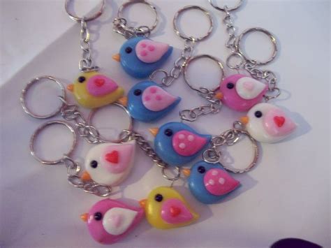 a bunch of key chains that have different colored birds on one end and ...