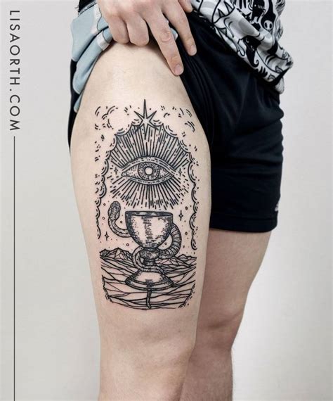 Occult themed tattoo located on the thigh, engraving