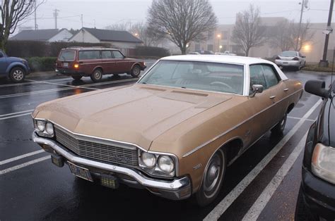 OLD PARKED CARS.: 1970 Chevrolet Impala 4-door hardtop.