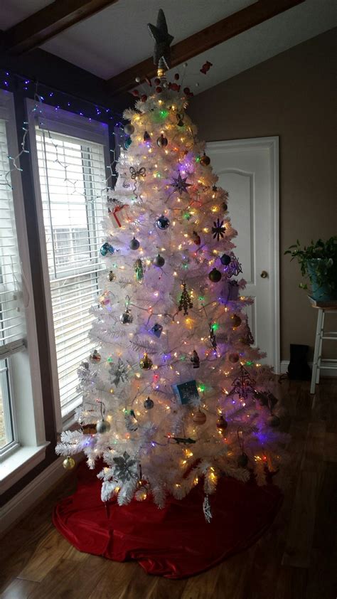 White Christmas tree with multi colored lights...Decorated with only a… | Christmas tree with ...