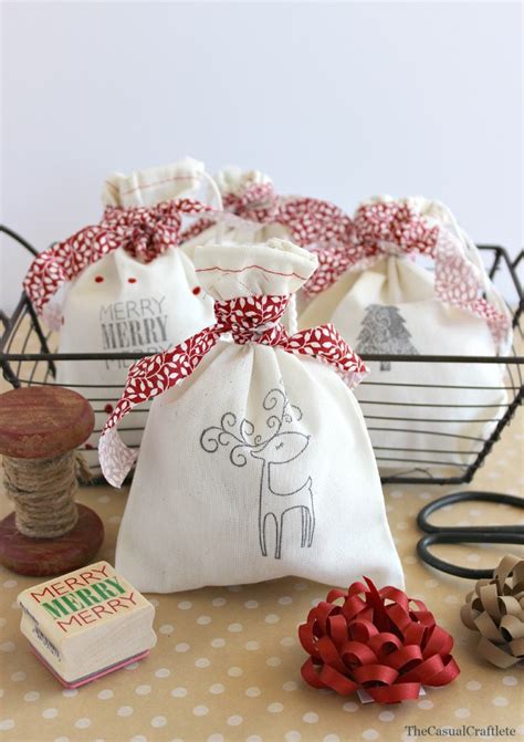 Picture Of DIY stamped Christmas bags with reindeer and red ribbon