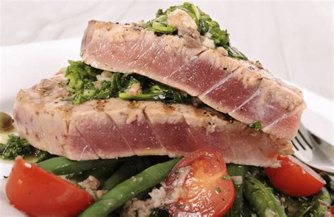 Ahi Tuna (Yellowfin) Steaks Grilled with a Mediterranean Flair. Yellowfin Tuna or Ahi Tuna is ...